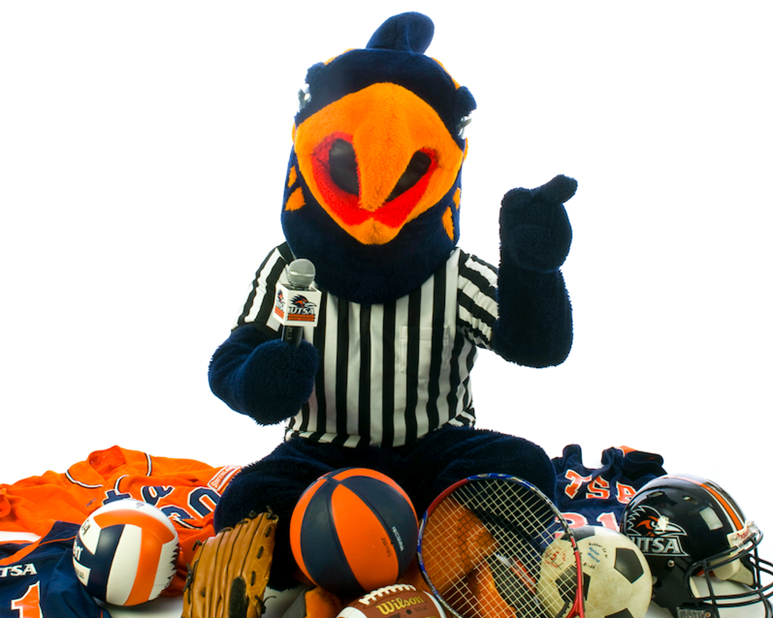The UTSA mascot, Rowdy the Roadrunner, sits in front of a white background surrounded by athletic gear