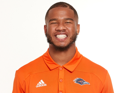 Frank Harris smiling in UTSA polo shirt