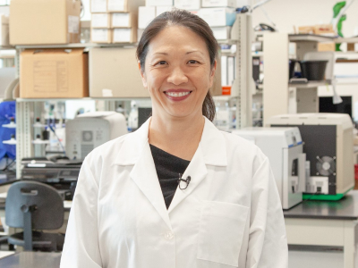 Dr. Jenny Hsieh smiling in her labcoat