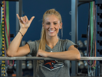 Kendall Kloza giving birds up in gym