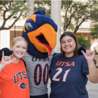 Rowdy smiling with students