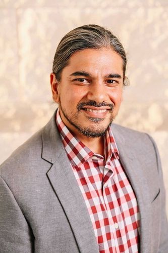 Joey Mukherjee smiling