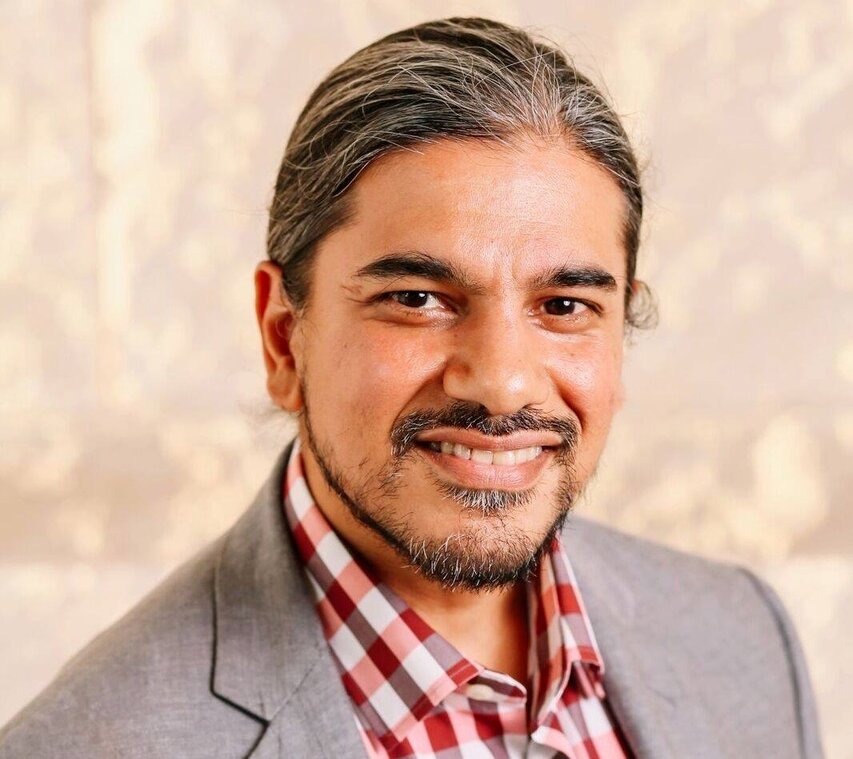 Joey Mukherjee smiling