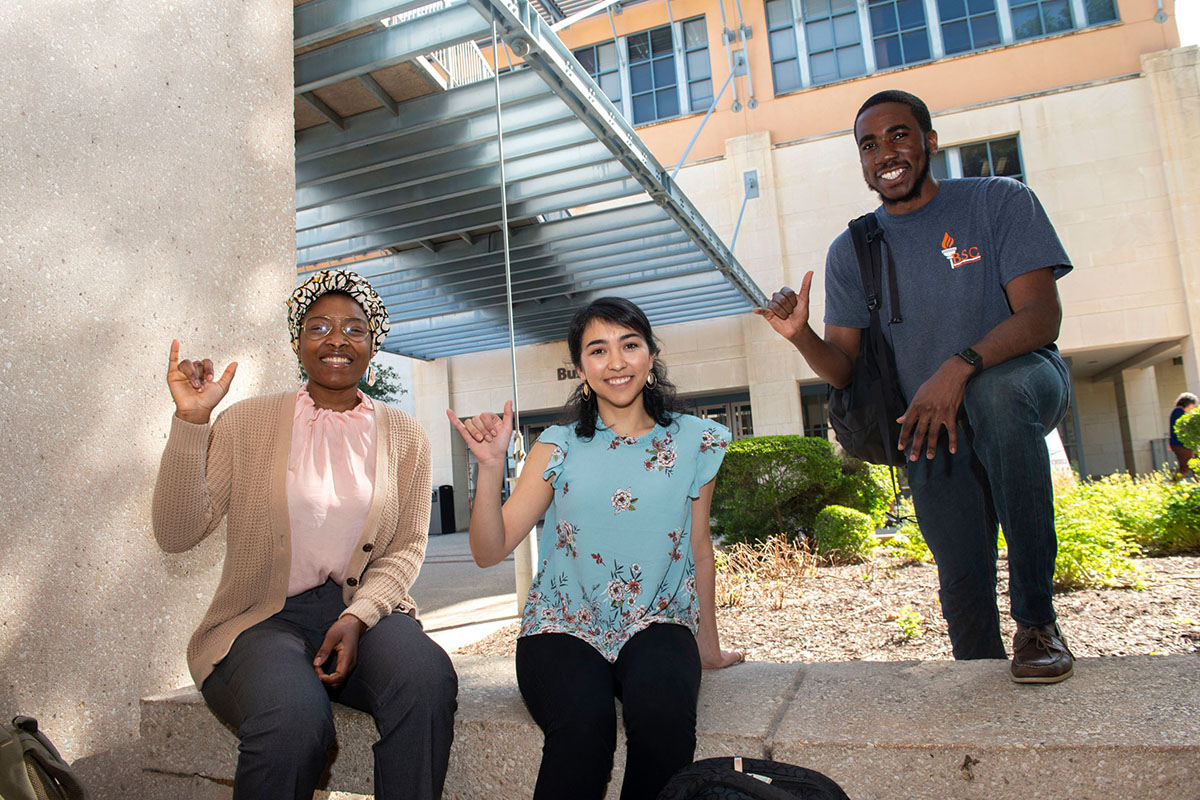 students in front of college of business