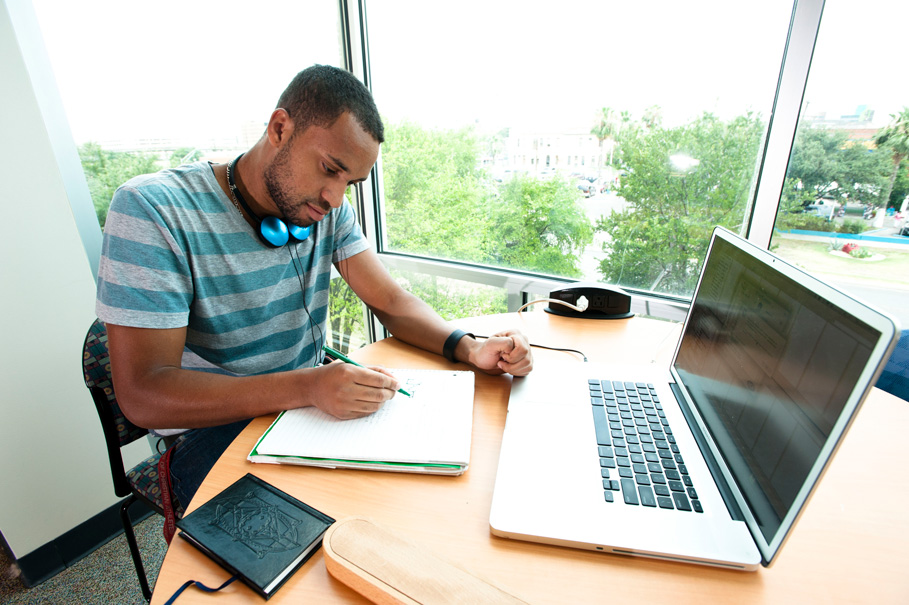 student studying with laptop