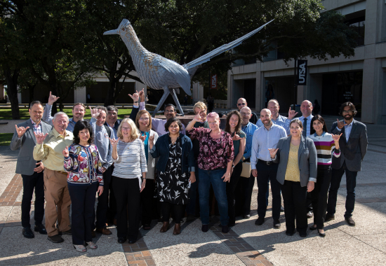 UTSA staff and faculty giving UTSA birds up