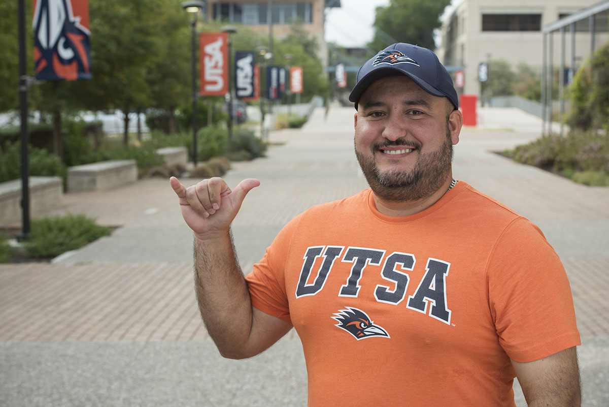 Student giving birds up on campus