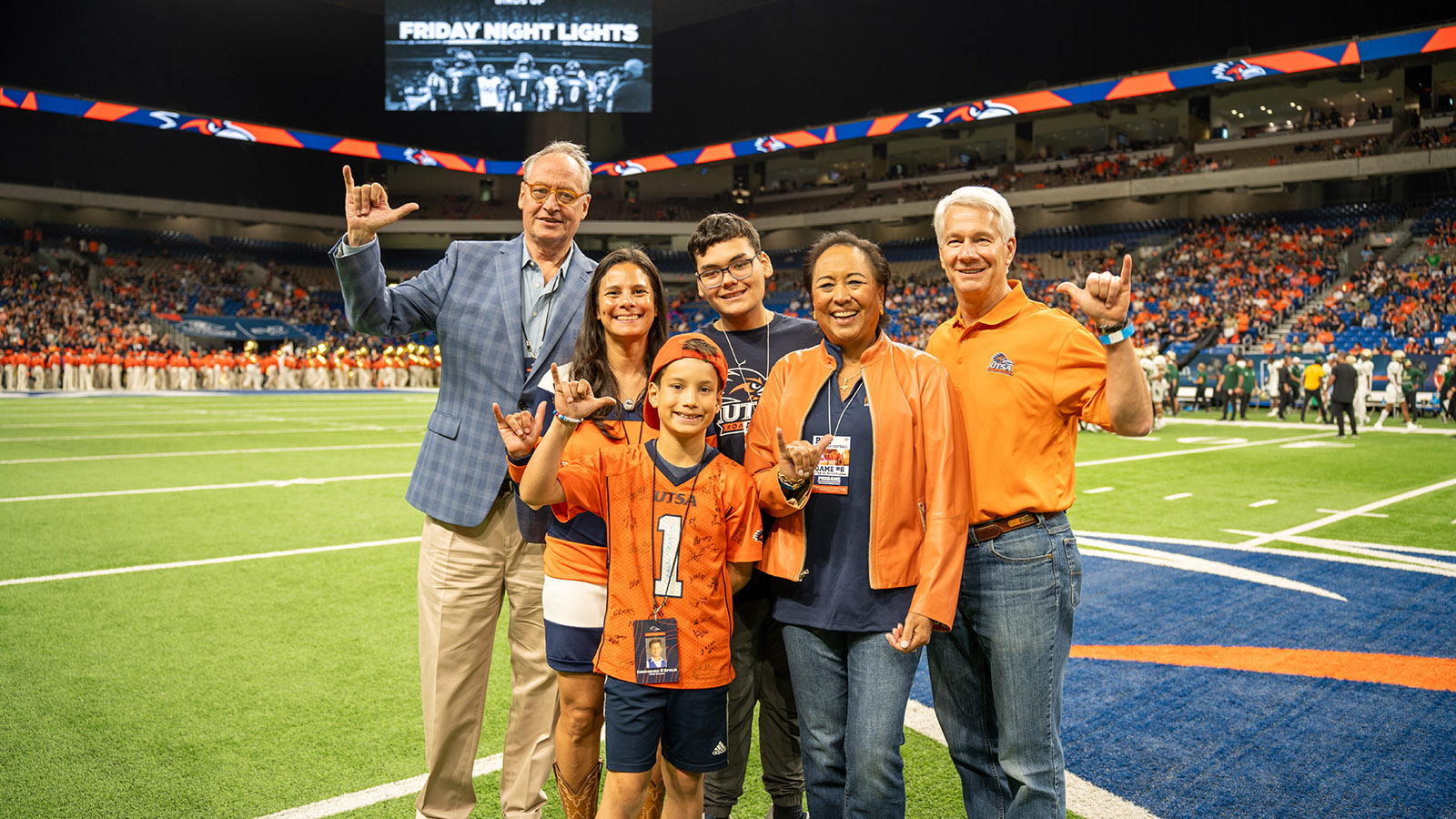  Sam Dawson and Nancy Kudla with President Eighmy on UTSA football field
