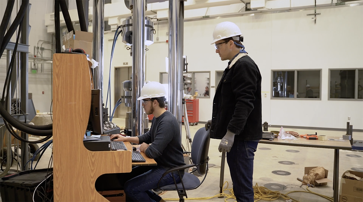 student at work being supervised by instructor