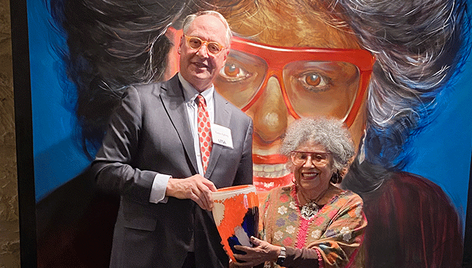 President Eighmy smiling with  Ellen Riojas 