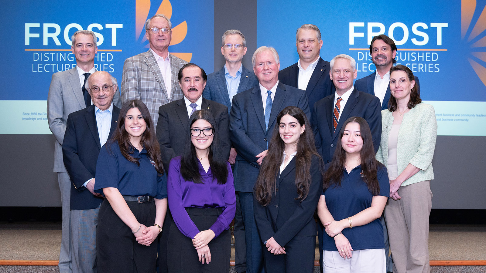 CLC members smiling on stage with UTSA students