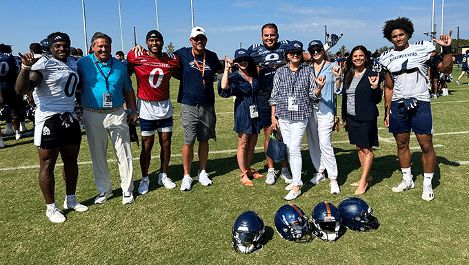 Greehey family with UTSA football players and head coach