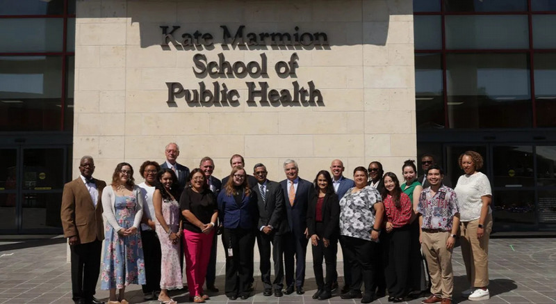UT San Antonio Board in front of Kate Marmion School of Public Health