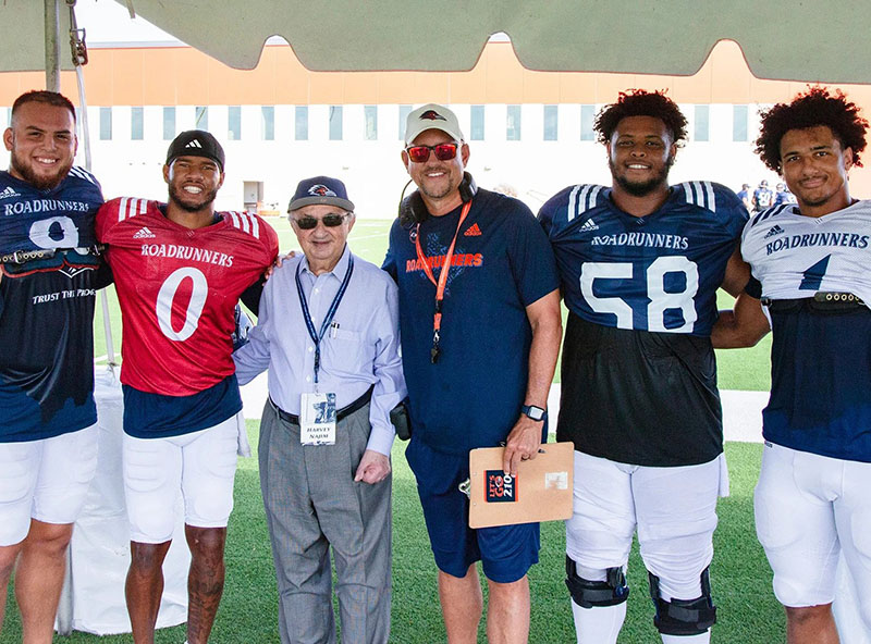 Harvey Najim smiling with UTSA football team