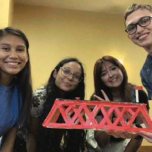 UTSA students building model bridge