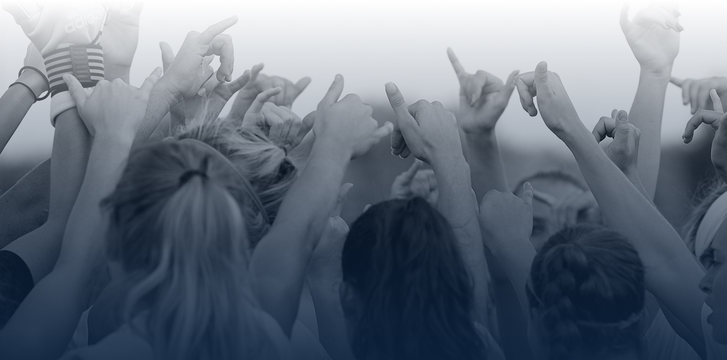 UT San Antonio student hands making the birds up sign 