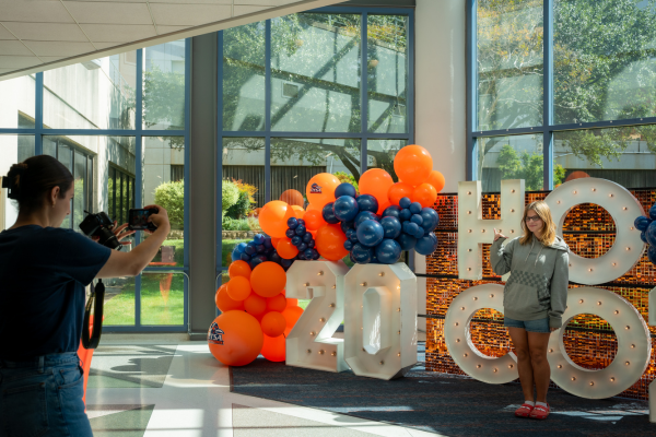 Students taking a photo in front of the HOCO letters