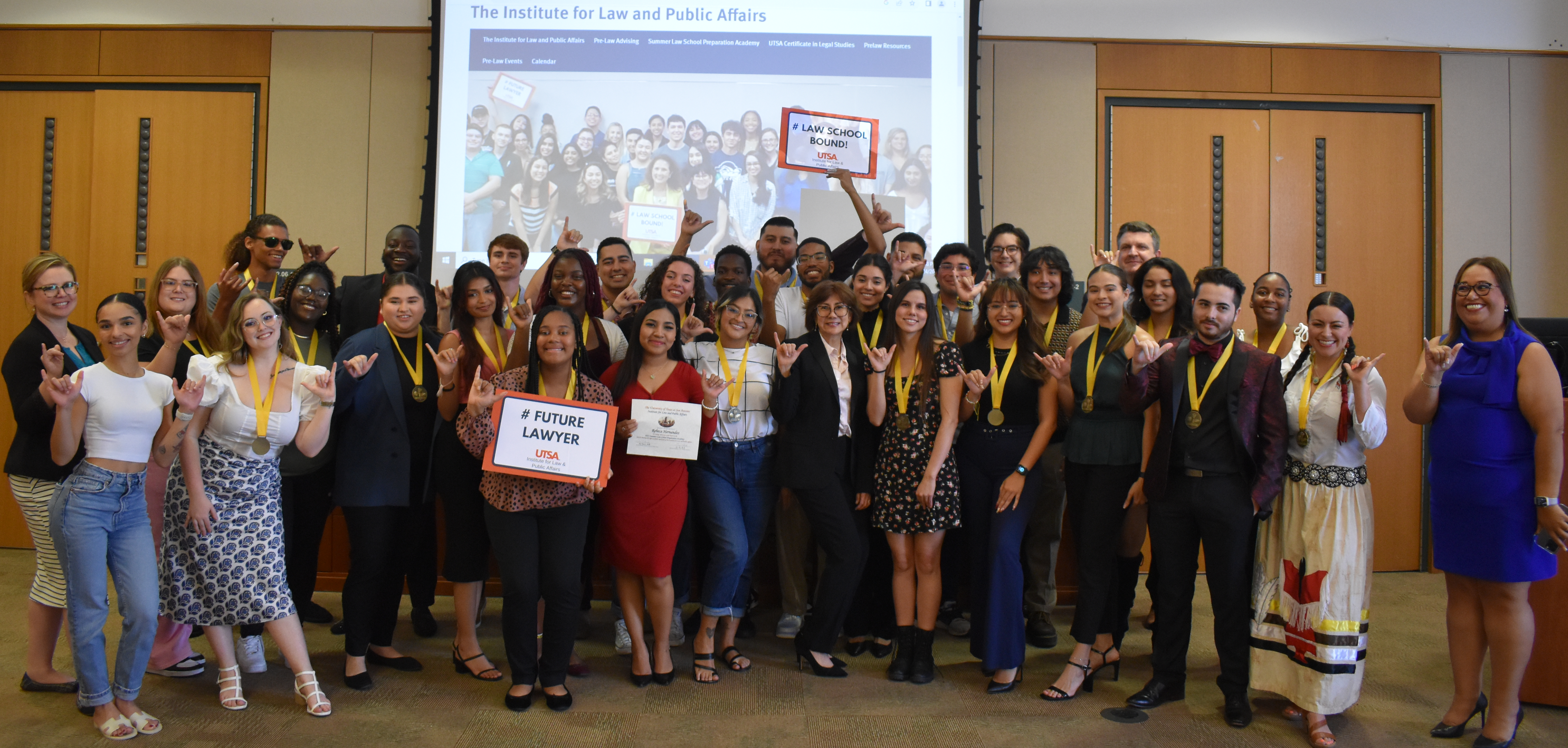 Group photo with sign of Law School Bound