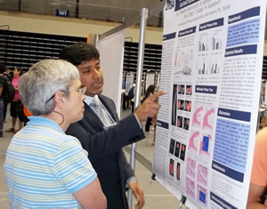 student presenting poster