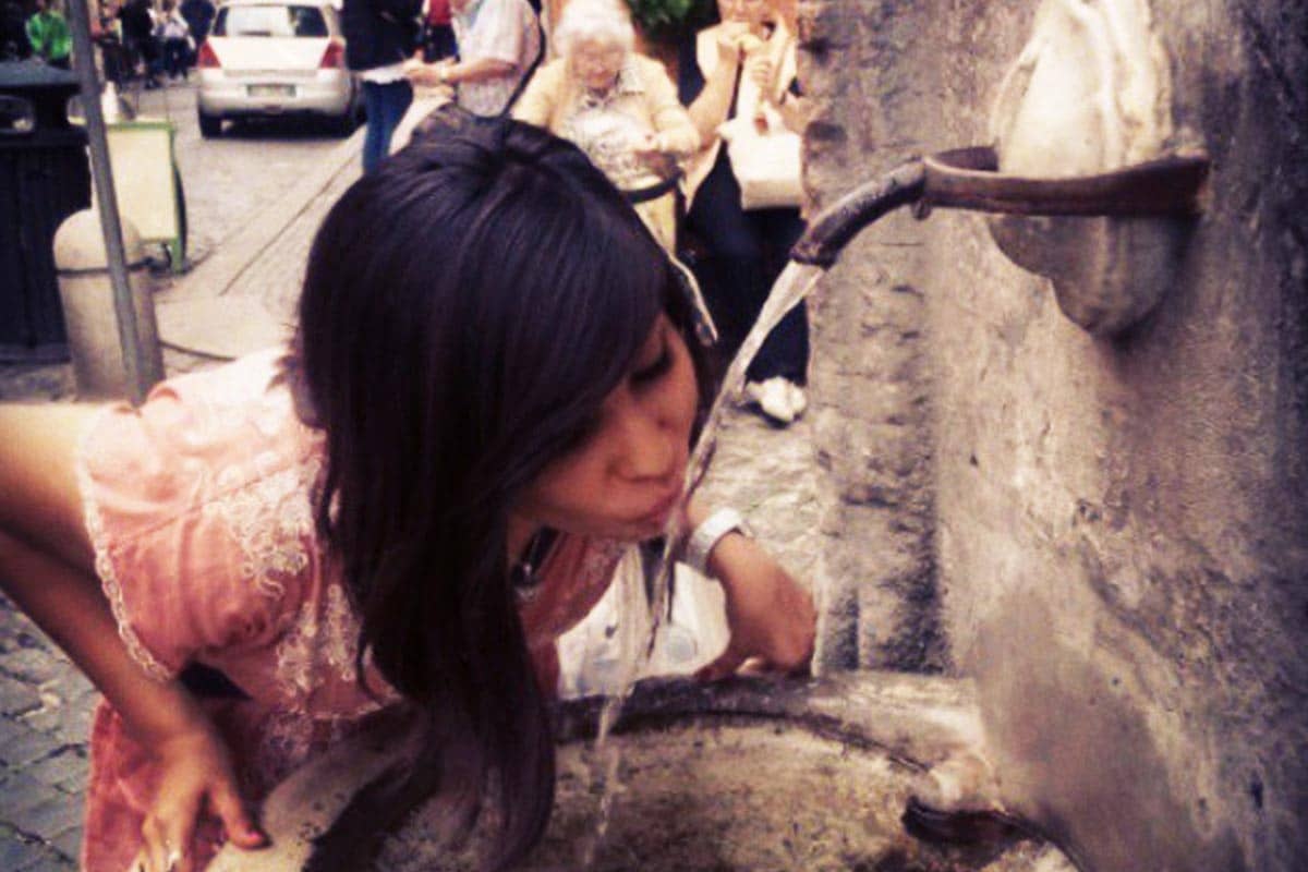 Salma Gomez '16 takes a drink from one of the more than 2,000 public water fountains, known as Nasoni, or big nose, located throughout Rome, Italy.