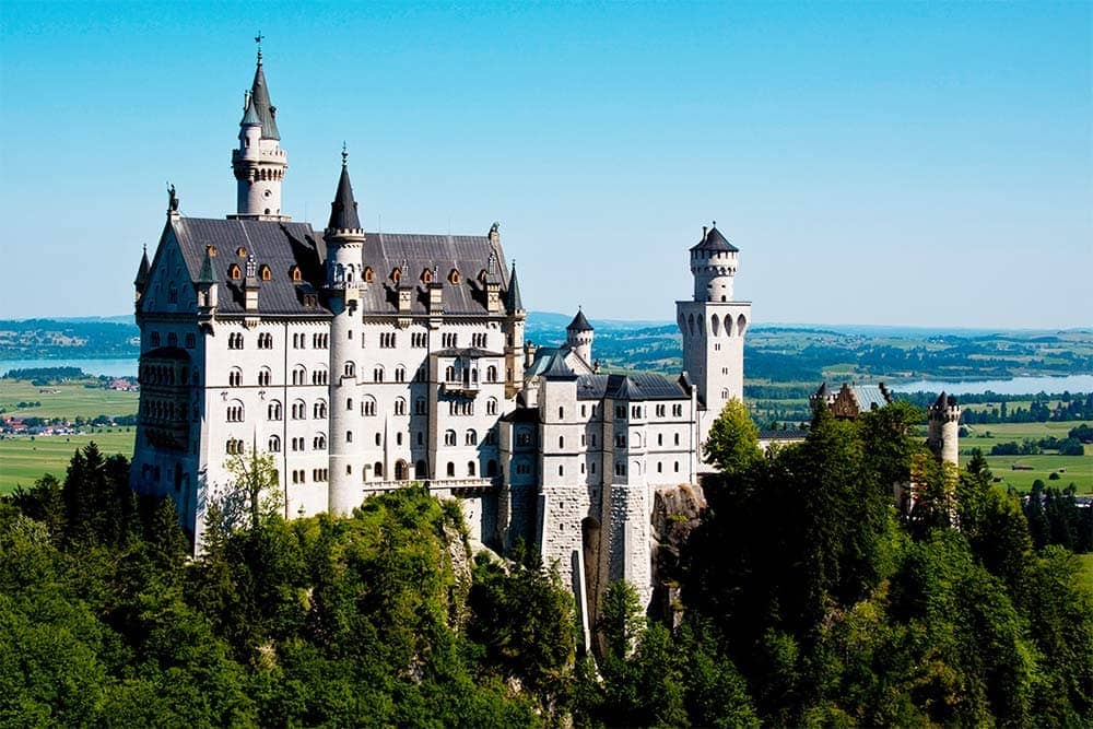 The 19th century palace Neuschwanstein Castle is nestled on a rugged hill above Hohenschwangau village in the German state of Bavaria.