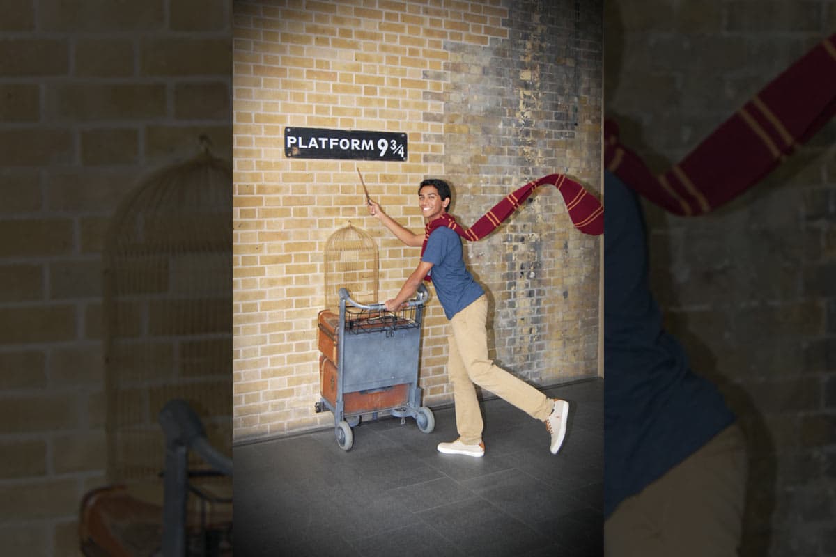 UTSA Top Scholar and biology major Bharath Ram in London's King's Cross station at the Harry Potter tourist location of Platform 9 3/4.