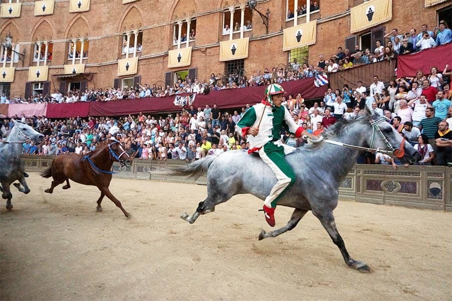Viewing the Palio di Siena horse race in Siena, Italy.
