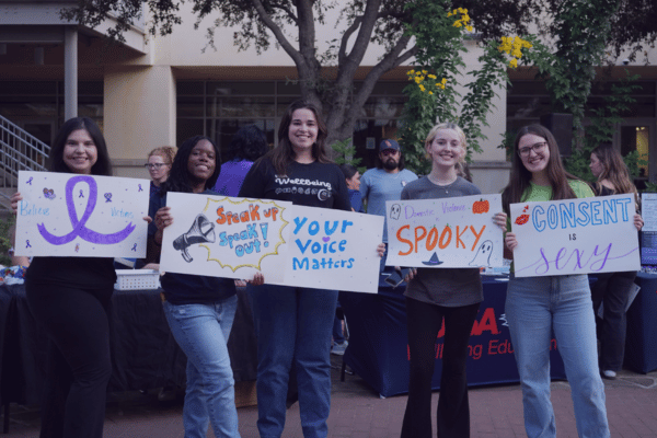 group of students holding posters at Take Back the Night