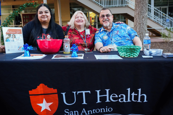 three staff from UT Health tabling at Take Back the Night