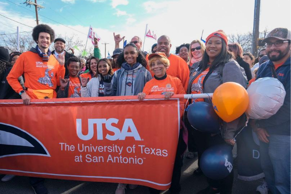 UTSA students, staff, faculty holding banner at MLK march