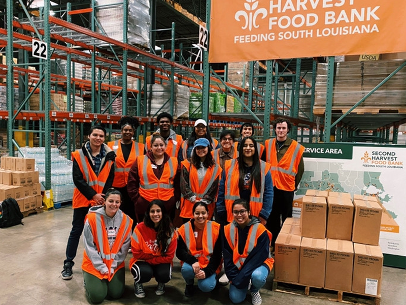 Group photo of students volunteering at a food bank.