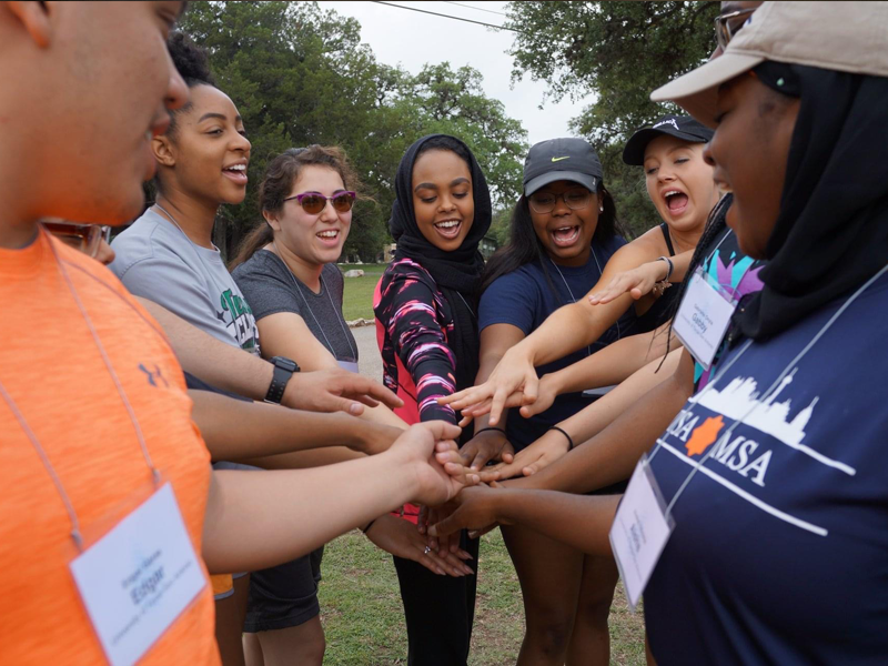 Photo of Leadership Takeover participants team building. 