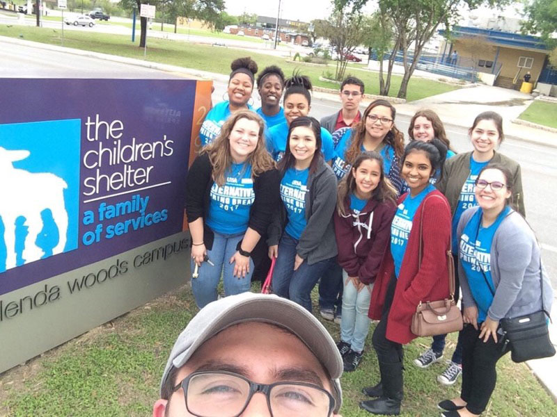 Group photo of VOICES members volunteering at the Children,s Shelter