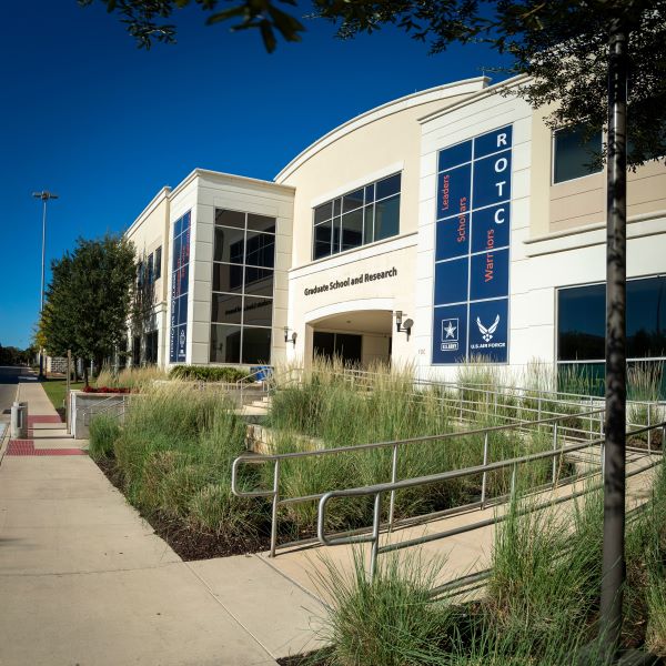 GSR Building with greenery in the bottom right corner and bright blue sky
