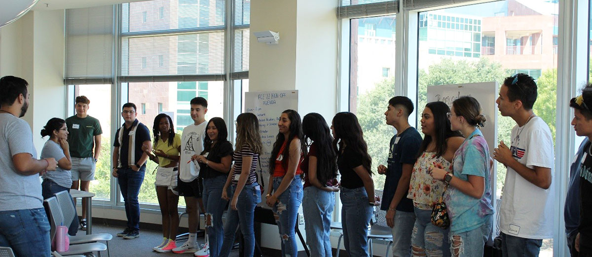 Group of students in front of a window