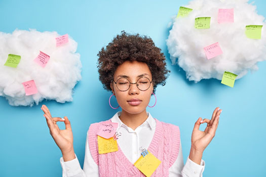 Person with notes on her while meditating