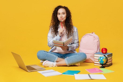 Student reading a notebook