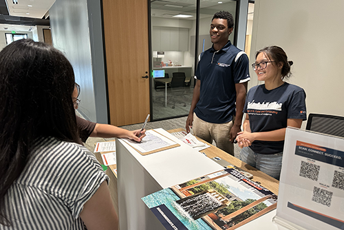 Students greeting each other in the USAA Student Success Center