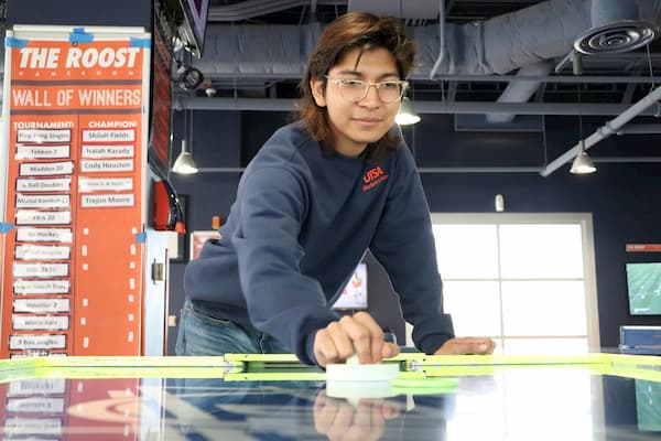 Student Playing Table Hockey