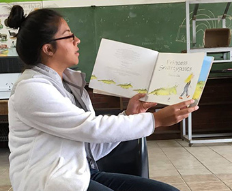 Diaz reads to students at a rural school in South Africa.
