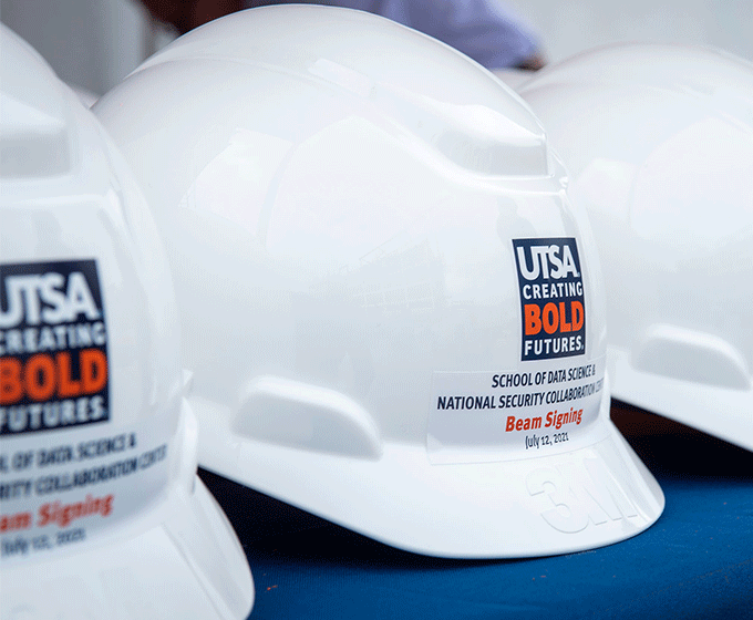 UTSA marks progress of School of Data Science and National Security Collaboration Center Building with beam signing 